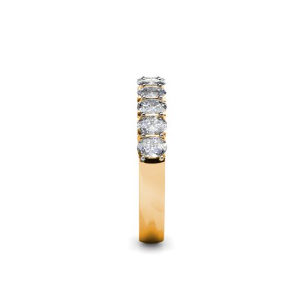 Side view of yellow gold oval diamond half eternity ring showing the band depth and setting
