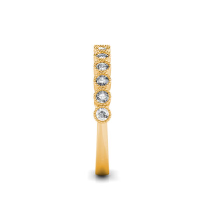 Side view of yellow gold milgrain bezel diamond half eternity band showing the band depth and setting
