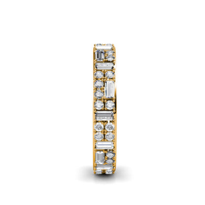 Side view of yellow gold baguette and round diamond eternity ring showing the band depth and stone setting