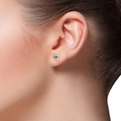 Yellow gold 0.40 carat diamond stud earring worn on the ear
