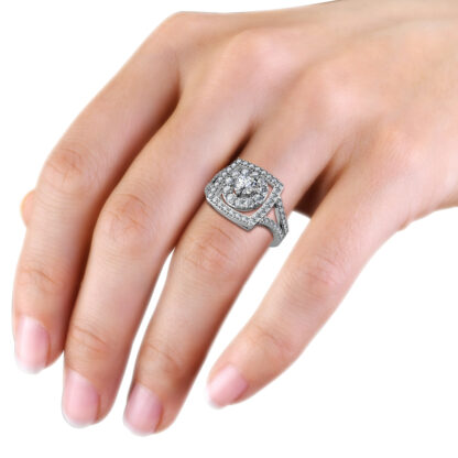 Double halo diamond engagement ring in white gold or platinum worn on a woman's hand